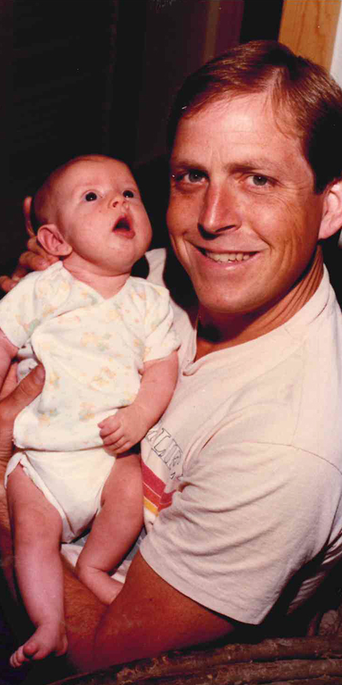 James Templeton holding his daughter