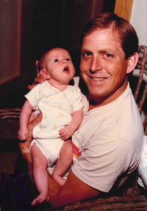 James Templeton holding his daughter