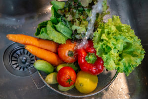 Organic food being washed before cooking or eating.